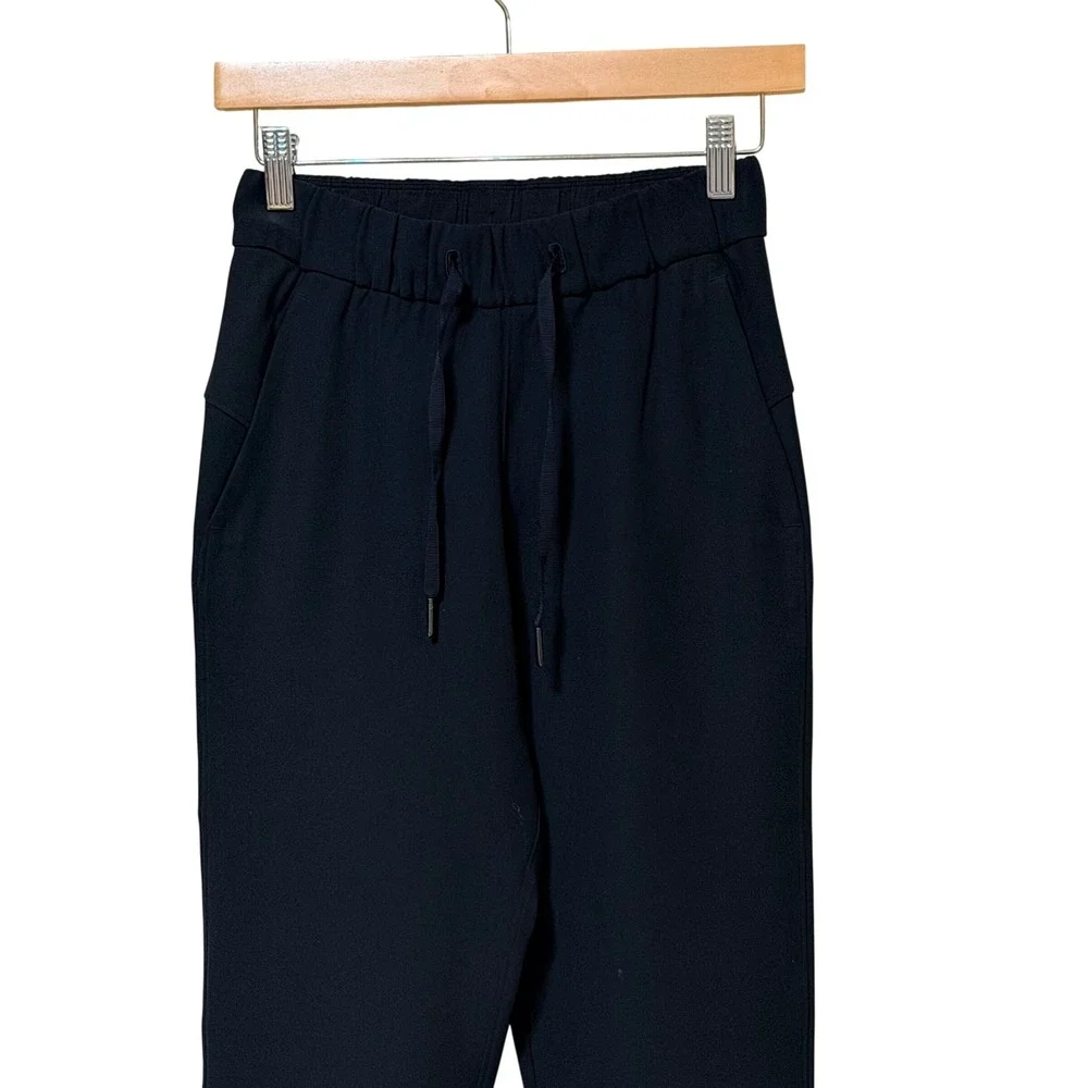 Lululemon On the Fly 7/8 Pant Black Luxtreme Jogger Size 2 LW5BPMS 25 Inseam